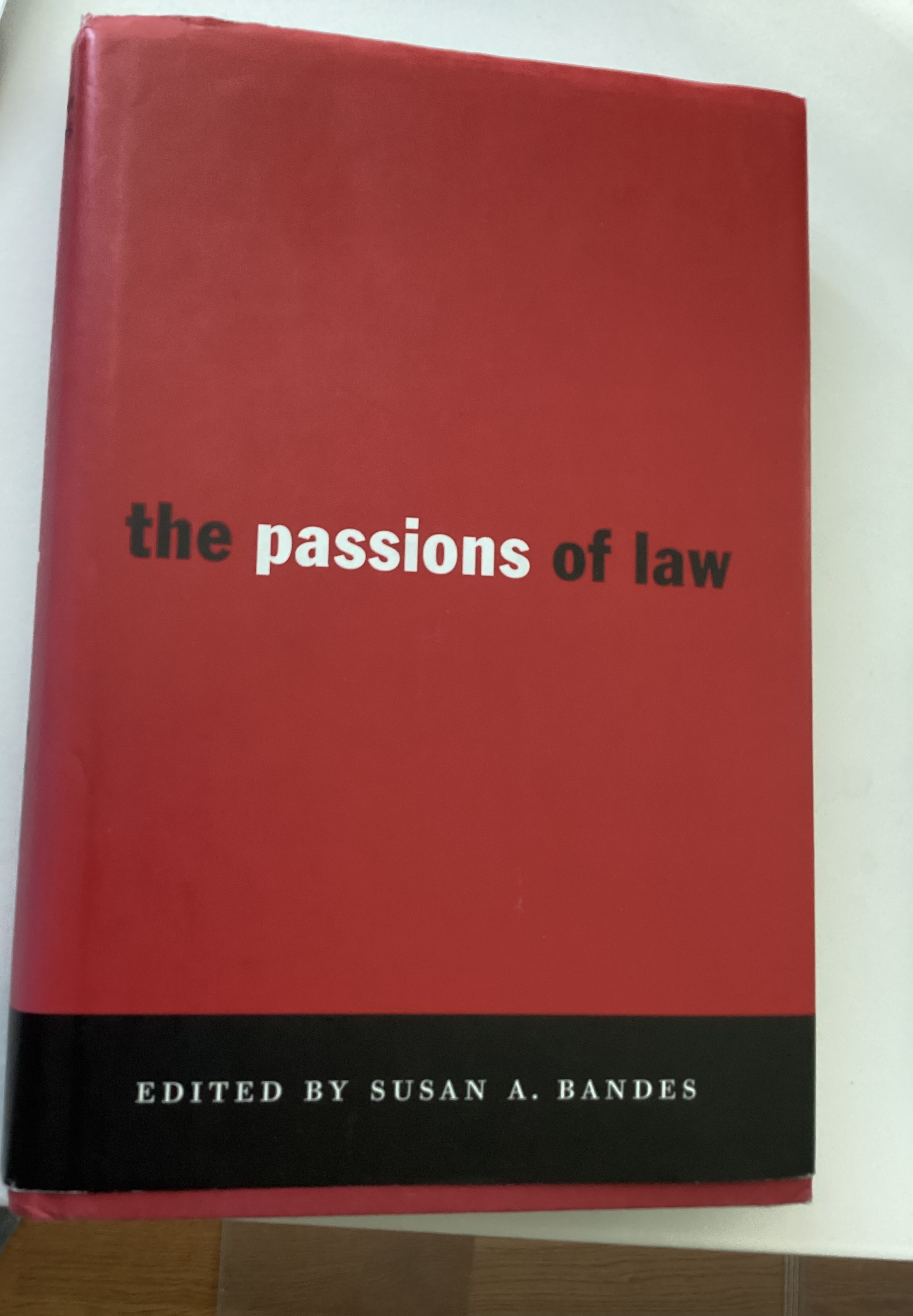 Cover photo of The Passions of Law by Susan A. Bandes (red and black cover with white writing)