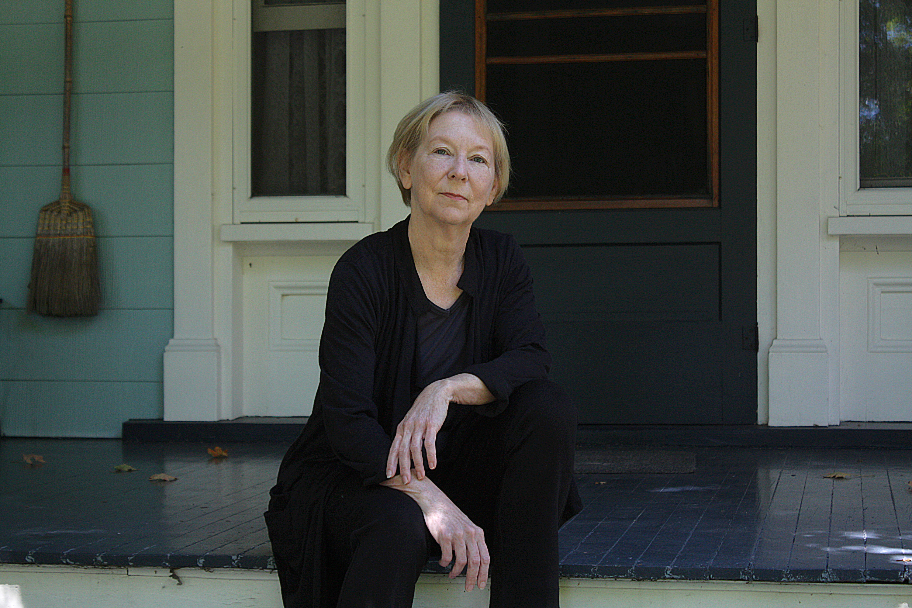 writer sitting on a porch 