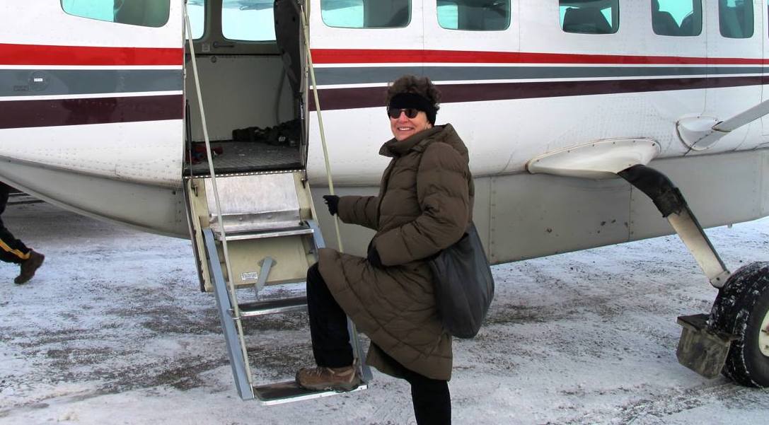 Stephanie Woodard boarding small plane in Alaska