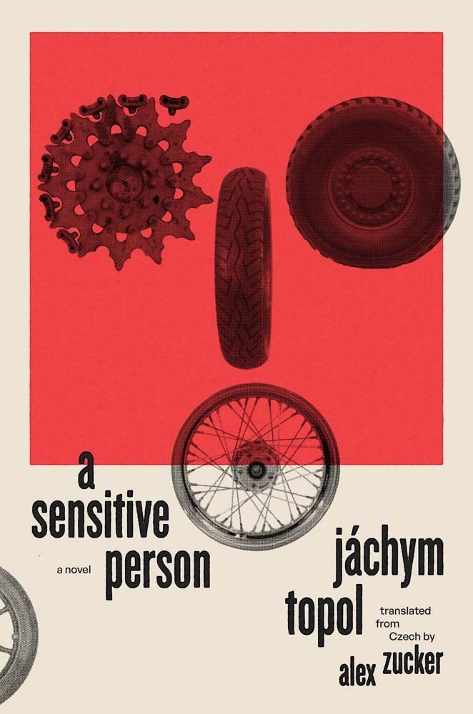 Cover of novel A Sensitive Person. In upper part on red, a tank wheel, car tire, and motorcycle tire. Below, a bicycle wheel half on red, half on beige. Black lowercase type says: "a sensitive person, jáchym topol, translated from czech by alex zucker."
