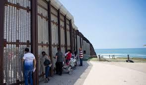 Photo of border wall, AP Photo/Gregory Bull, File